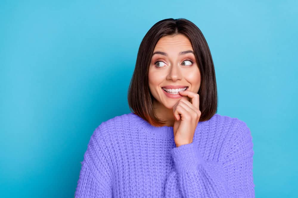 Cheerful young woman with bright smile showcasing cosmetic dentistry results in Colorado Springs