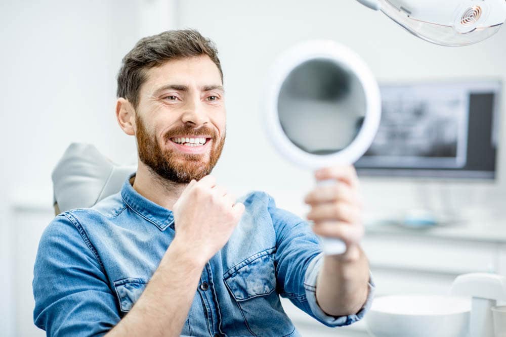Man receiving comprehensive gum disease treatment at dental office in Colorado Springs, CO