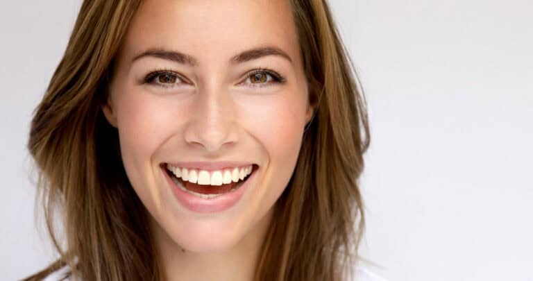 Young woman with bright healthy smile following dental care tips in Colorado Springs, CO