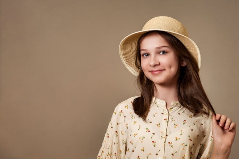 Teen girl with dimples and beautiful smile after improving appearance with cosmetic dentistry in Colorado Springs