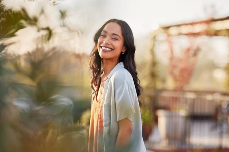 Young woman with healthy smile promoting preventive dentistry in Colorado Springs, CO